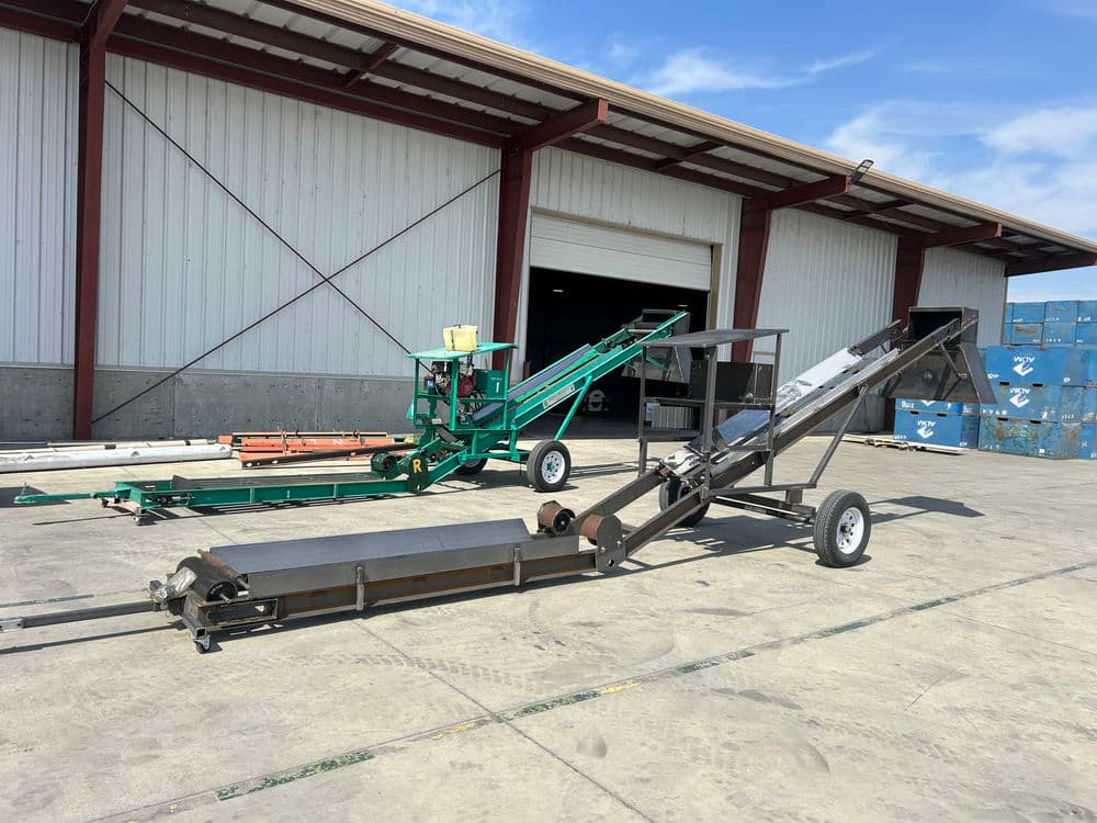 Conveyor belts and machinery in a large industrial warehouse setting.